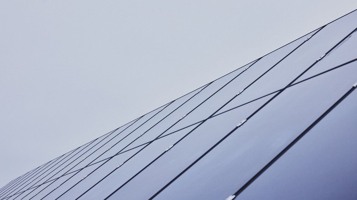 Solar panels in the field by the Cigale & Fourmi studio in Espoo