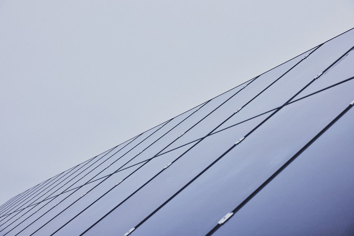 Solar panels in the field by the Cigale & Fourmi studio in Espoo